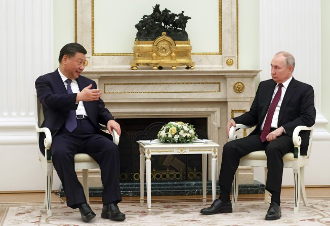 Chinese President Xi Jinping speaks with Russian leader Vladimir Putin during their meeting at the Kremlin on Monday. Photo: Kremlin Pool Photo via AP