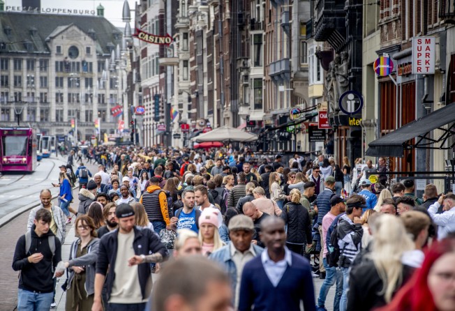 A shopping street in Amsterdam on July 25, 2020. The Netherlands proved an exception in the Ipsos and WHR happiness reports by ranking highly in both. Photo: Getty Images