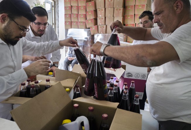 Passover celebrates the deliverance of the Jewish people from slavery in Egypt, and begins with the seder meal, celebrated with kosher wine. Photo: EPA