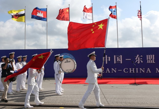 Members of the Chinese People’s Liberation Army and navy hold Chinese flags during the China-Asean Maritime Exercise in Zhanjiang, Guangdong province, China in October 2018. Photo: Reuters