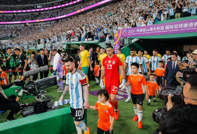 Lionel Messi leads Argentina onto the pitch for their friendly against Australia in Beijing. Photo: EPA-EFE
