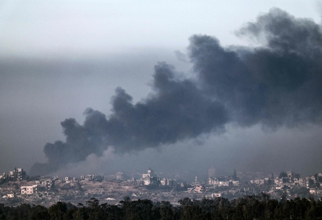 A photo taken from a position in southern Israel along the border with the Gaza Strip, shows Smoke billowing over the Palestinian territory during Israeli bombardment on Thursday amid continuing battles between Israel and Hamas. Photo: AFP