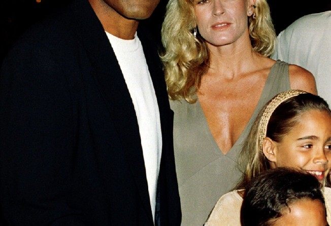 OJ Simpson is shown with his ex-wife Nicole Simpson and their children, daughter Sidney Brooke and son Justin, at the Naked Gun 33 1/3 premiere in 1994. Photo: Reuters