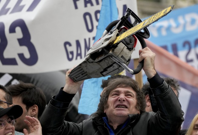 Javier Milei brandishes a chainsaw during a campaign event in La Plata, Argentina, in September 2023. Photo: AP