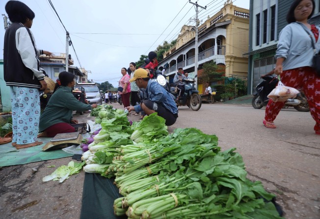 Vendors selling vegetables at a street market in Kyaukme in Myanmar’s northern Shan State earlier this month. Photo: AFP