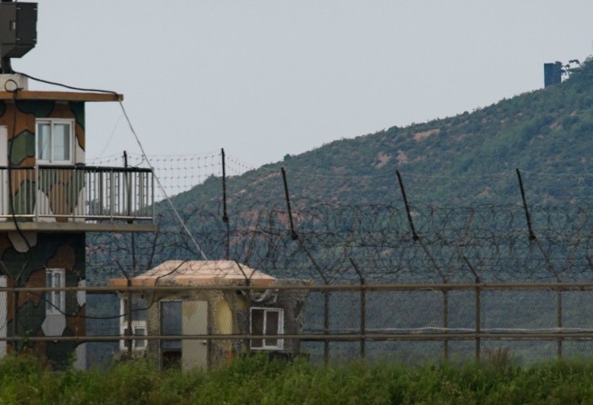A North Korean propaganda speaker (top) is seen behind a South Korean military guard post (left) seen across the Demilitarised Zone separating the two countries. Photo: AFP
