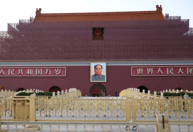 Security personnel keep watch near the portrait of Mao Zedong displayed on the Tiananmen Gate in Beijing on June 3. Photo: Reuters