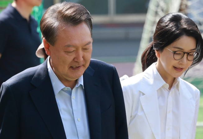 Former South Korean President Yoon Suk-yeol and his wife, Kim Keon-hee, at a polling station in Seoul on Tuesday. Photo: EPA-EFE/Yonhap