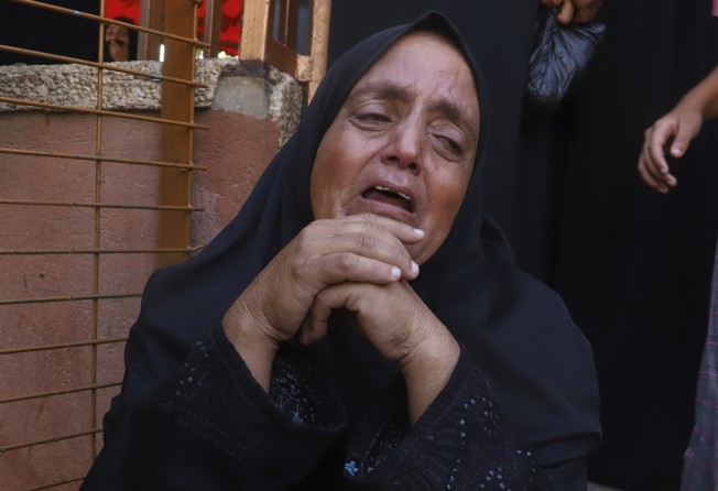 A Palestinian woman mourns her relative, who was killed in Israeli strikes outside Nasser Hospital in Khan Younis, southern Gaza Strip on Saturday. Photo: AP