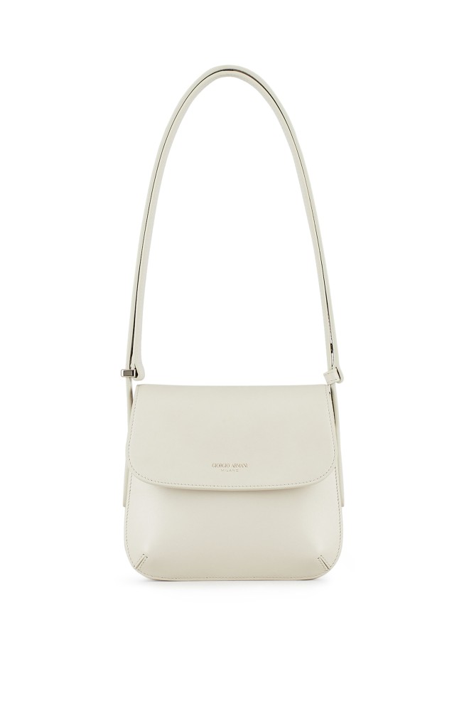 Contrast the dark shades of a winter wardrobe with a white La Prima bag.