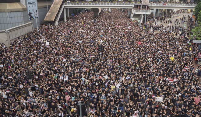 Protesters march through Wan Chai, Hong Kong. Photo: Antony Dickson
