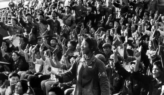 Hundreds of Red Guards, a propaganda squad made mostly of high school and university students, brandishing copies of the "Little Red Book", a collection of Mao Zedong quotes, at a rally in 1966.