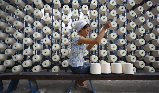 A worker in a textile factory in Suining, Sichuan province.
