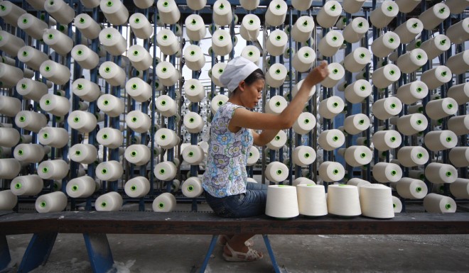 A worker in a textile factory in Suining, Sichuan province.