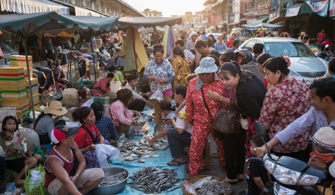 Fish vendors at a local market in Cambodia. 