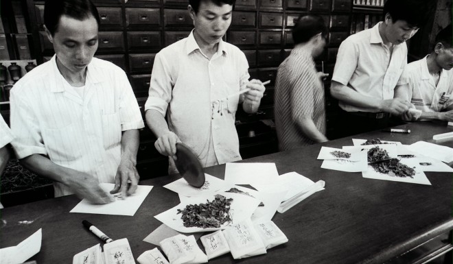 Staff at Eu Yan Sang’s Chinese medicine shop in Central dispensing Chinese herbs in the 1980s. The company now has 248 retail outlets and 34 clinics in Asia and further afield. Photo: SCMP