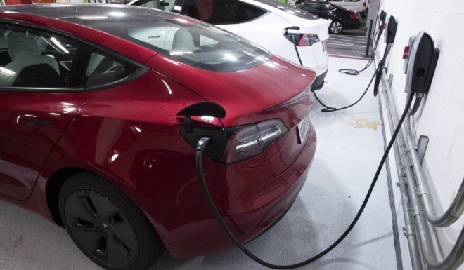 Tesla electric vehicles charging in a garage. Photo: EPA-EFE