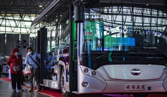 Visitors looking at a new energy bus during a promotional activity for new energy vehicles in Beijing. Photo: Xinhua