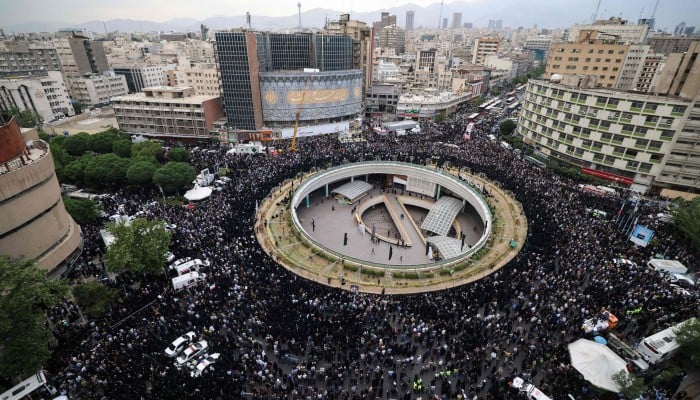 In pictures: thousands mourn Iran president Ebrahim Raisi after his