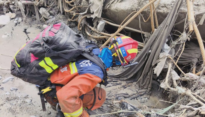 Glacial collapse triggers flash flood on Nepal-China border; rescuers pull two survivors from rubble as over 2,500 remain missing