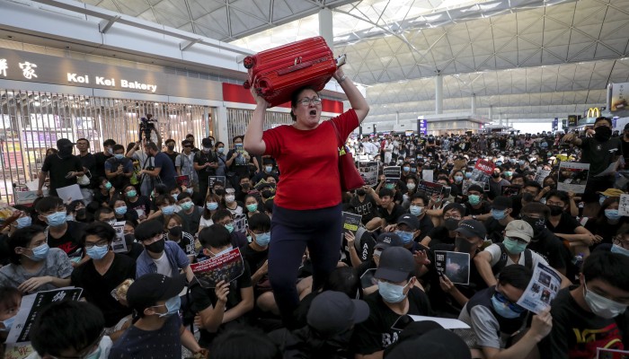 Anti Government Protesters Severely Disrupt Hong Kong International Airport For Second Day Running South China Morning Post