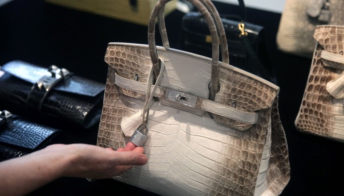 Five of the most expensive bags ever sold at a Christie's handbag auction:  Hermès Kelly and Birkins and a vintage Chanel
