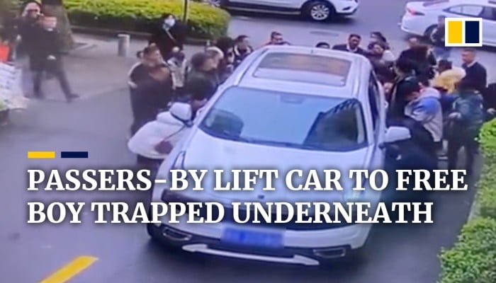Passers-by in China lift car to free boy trapped underneath | South ...