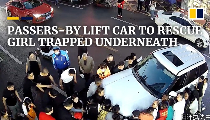 Passers-by lift car to rescue girl trapped underneath in China | South ...