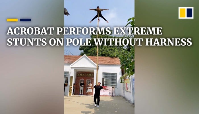 Acrobat Performs Extreme Stunts On Pole Without Harness South China