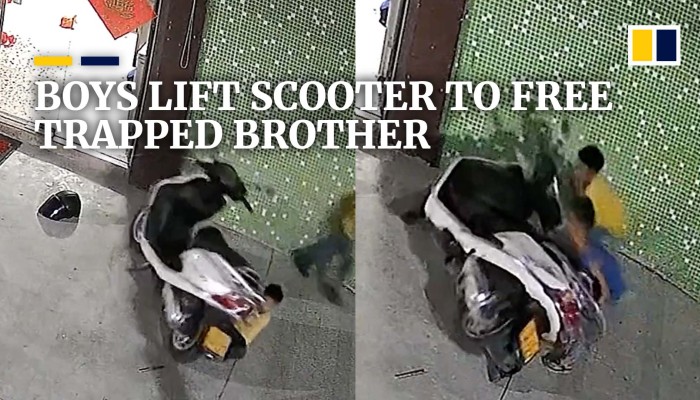 Chinese boys lift scooter to free trapped brother | South China Morning ...