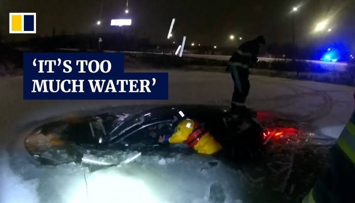 Video shows dramatic rescue of woman trapped in car sinking into frozen ...