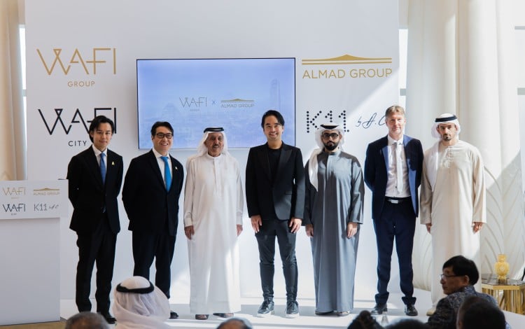 Sheikh Mana bin Khalifa Al Maktoum (third from left) and Adrian Cheng (centre), pictured at a signing ceremony on Wednesday in Dubai. Photo: Handout