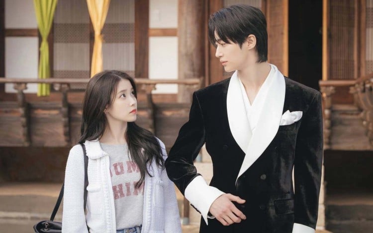 IU (left) and Byeon Woo-seok in a still from Perfect Crown.