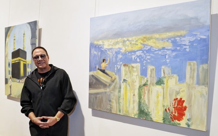 Jean-Claude Van Damme with his artworks in an exclusive painting vernissage of his city-themed oil paintings in Hong Kong at the University Museum and Art Gallery of the University of Hong Kong on March 7, 2026. Photo: Elson Li
