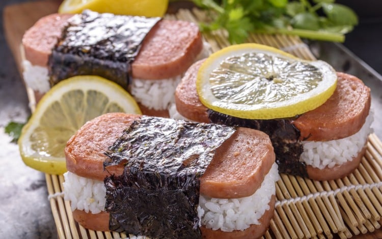 People in Okinawa transformed US dishes and ingredients such as Spam into beloved local food items, like Spam musubi (pictured). Photo: Getty Images