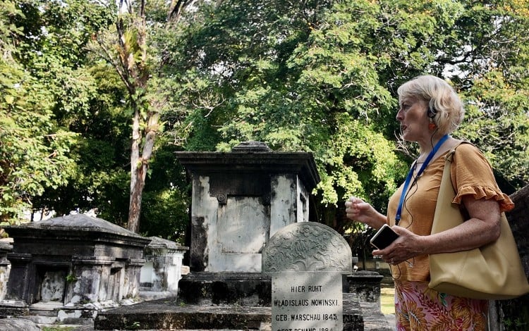 A British visitor attends a tour of the Old Protestant Cemetery in Penang, Malaysia. Photo: Ushar Daniele
