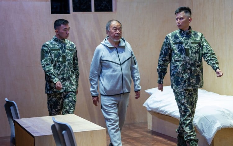 Chinese artist Ai Weiwei re-enacts his 81-day detention in a Chinese prison in Sewing a Button, a 24-hour live durational performance held on July 3 and 4, 2026, that was part of his “Button Up!” exhibition in Manchester, UK. Photo: Hugo Glendinning