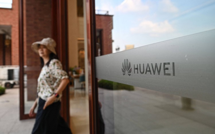 The Huawei logo is seen on glass at the compamy’s Lianqiu Lake research campus during a media tour in Shanghai on September 16, 2026. Photo: AFP