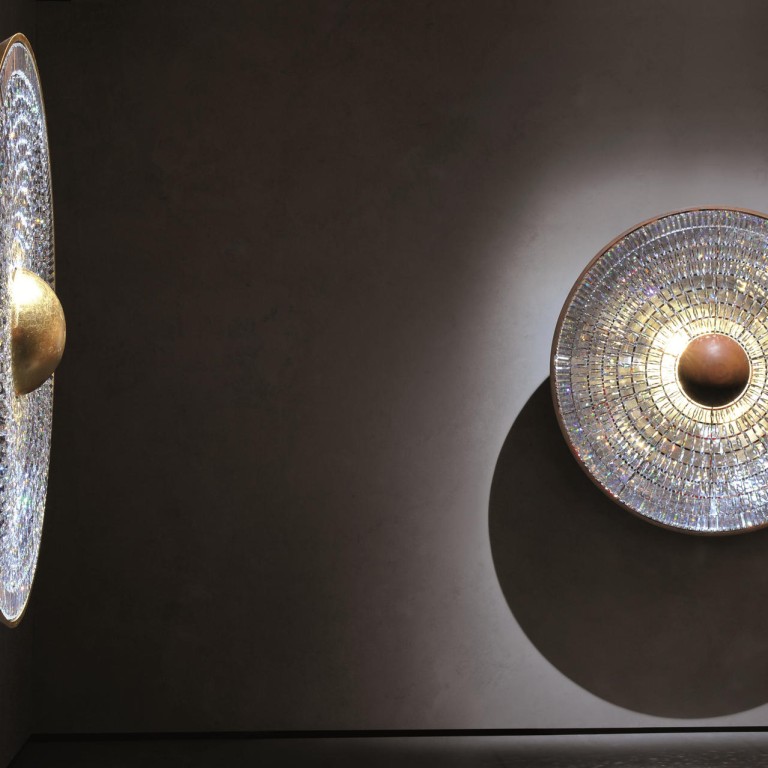 Swarovski collaborations include (above) Swarovski's Iris, a unique interpretation of the human eye with design duo Fredrikson Stallard, a Bell dress (below left) from Alexander McQueen, Celeste necklace (bottom left) by Zaha Hadid, and Mary Katrantzou's Jewel Tree dress (bottom right).