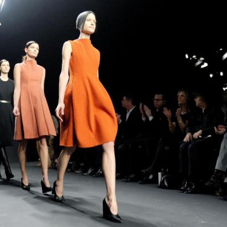 Calvin Klein Collection creative director Francisco Costa (below right) and models (above) at the Autumn / Winter 2012 runway show in New York. Photos: BILLY FARRELL AGENCY