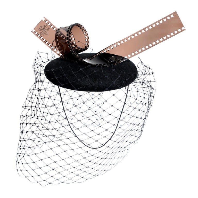 CHARLOTTE OLYMPIA: British milliner Piers Atkinson adds a playful twist to the classic wool felt veil with an acrylic film strip, HK$4,500