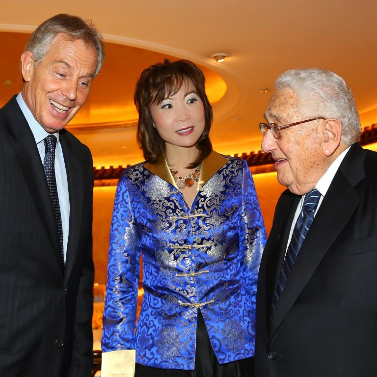 Jing Ulrich with former British prime minister Tony Blair and former US secretary of state Henry Kissinger at a JPMorgan conference.