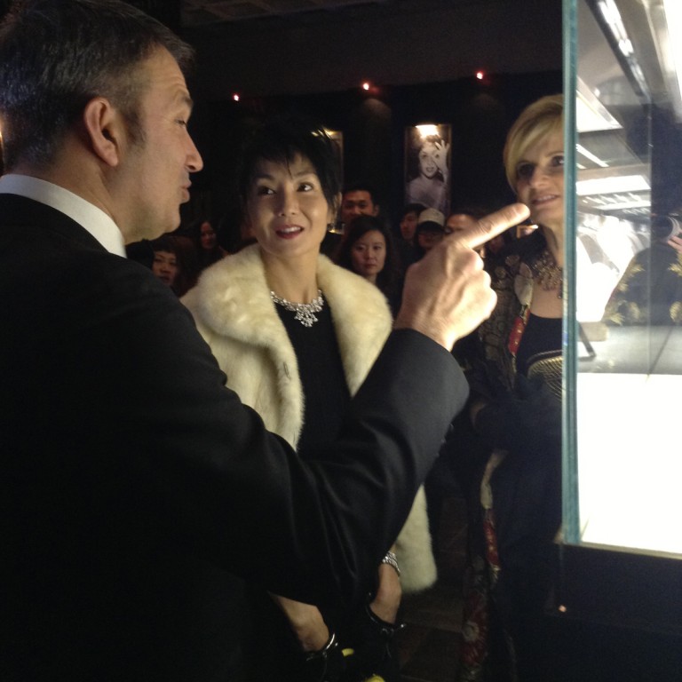 Chinese diva Maggie Chueng wears a diamond necklace to complement her black dress