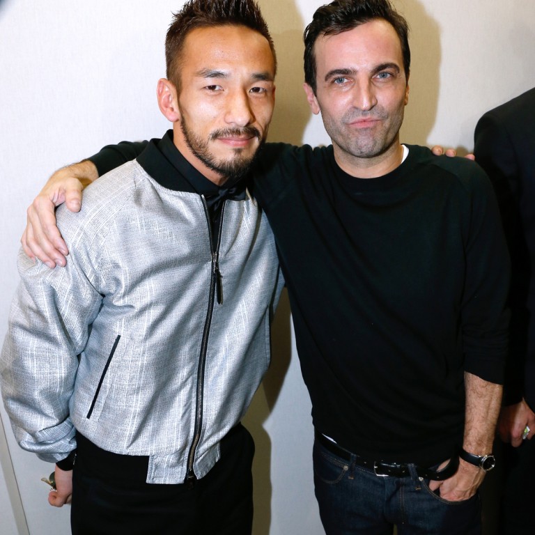 Japanese soccer star and Louis Vuitton fan Hidetoshi Nakata congratulates Nicolas Ghesquière