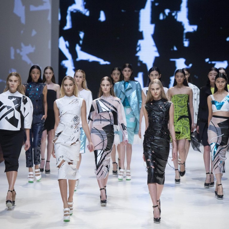 Models present Masha Ma's creations on the first day of Hong Kong Fashion Week for autumn/winter 2014. Photo: EPA