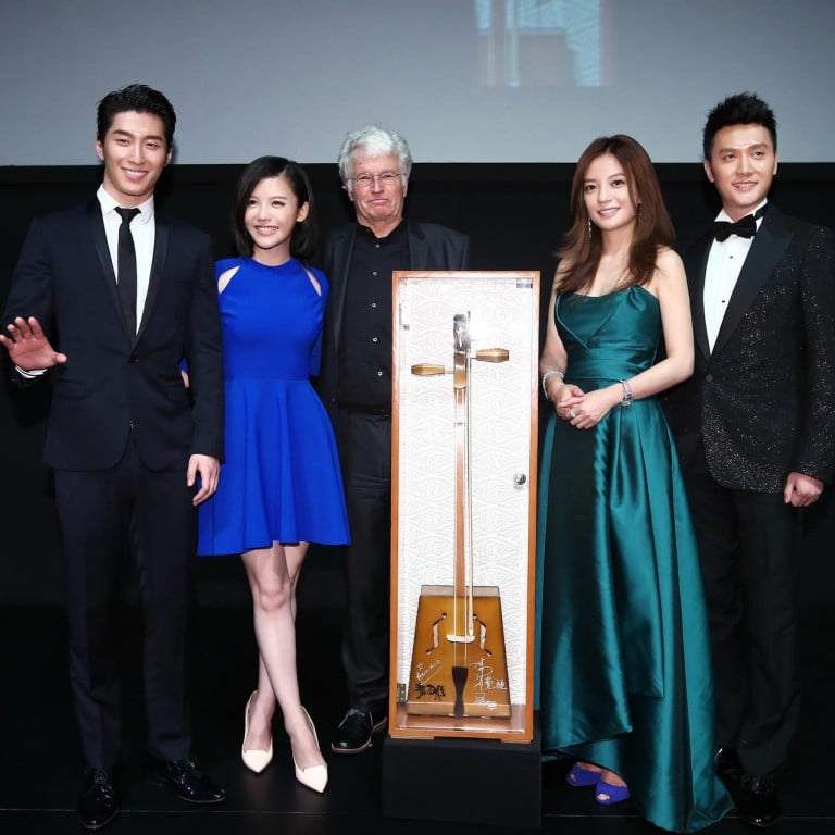 The cast and crew of the film Wolf Totem donated a horse-head fiddle to support the development of Chinese cinema