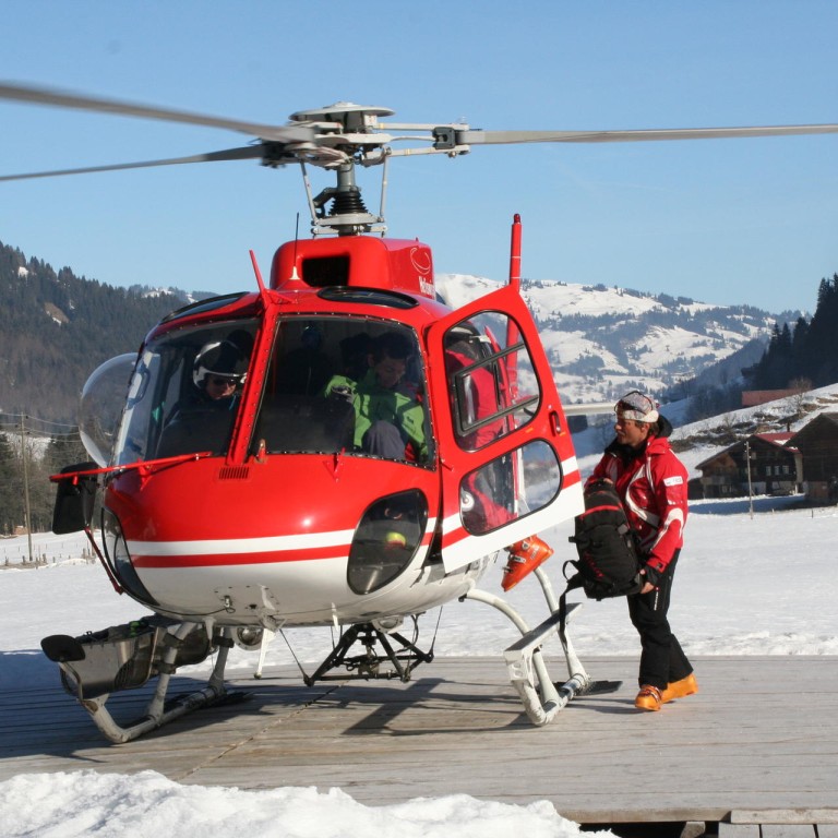 A helicopter at the Alpina Gastaad in Switzerland takes snowboarders to unchartered terrain. Photos: Mani Raaflaub, Julian Love