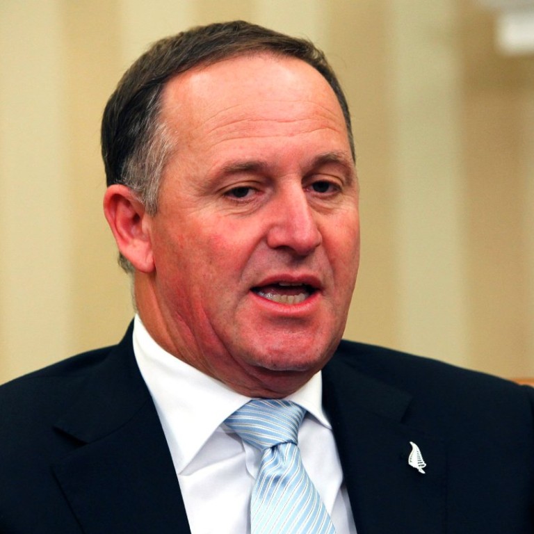 Prime Minister John Key apologises for pulling waitress's ponytail
