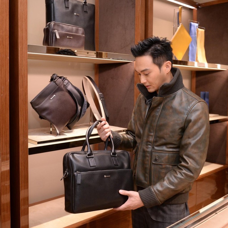 Julian Cheung checking out the goods, looking chic in a cool leather jacket #stylescmp