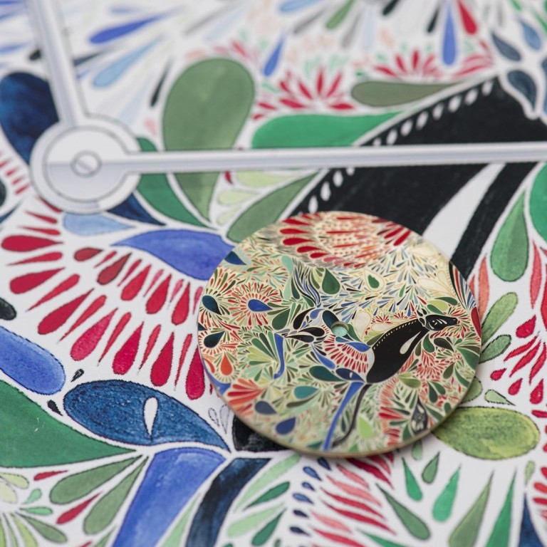 A Hermès watch dial inspired by the maison's signature printed scarves.